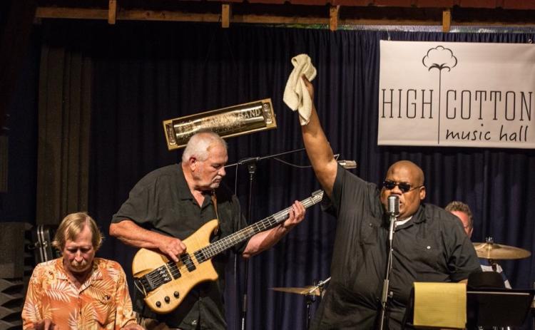 Marshall Walker, pictured above, doing what he loves most: playing bass with “Big C” at High Cotton Music Hall Blues Jam. 