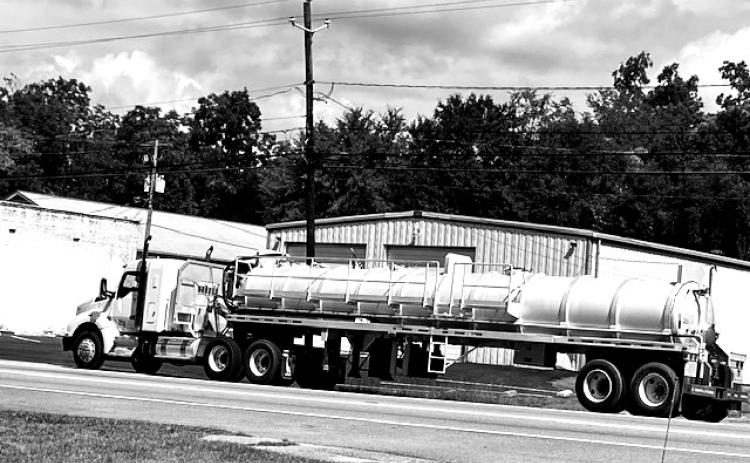 A big-rig-tanker load of industrial waste, aka soil amendment or sludge, sits along the roadside in Lexington.