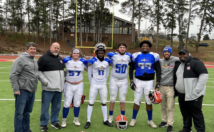 From left to right: Hart County head football coach Cory Dickerson, offensive coordinator Roger Gentry, offensive lineman Nick Carlson, defensive back Keith Curry, offensive lineman Logan Beard, defensive lineman Derrick Clarke, quarterbacks coach Caleb Sorrells, and defensive coach Don McCord at the FCA All-Star game on Dec. 17.