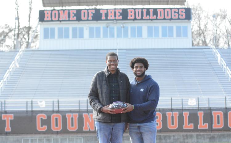 University of North Carolina defensive end Kaimon Rucker, a former Hart County standout, shares a commemorative football with Ramsey Gaines, 16, who recently received news that he is cancer-free. Rucker dedicated his team’s Oct. 1 win over Virginia Tech to Gaines, a junior at Hart County High School.