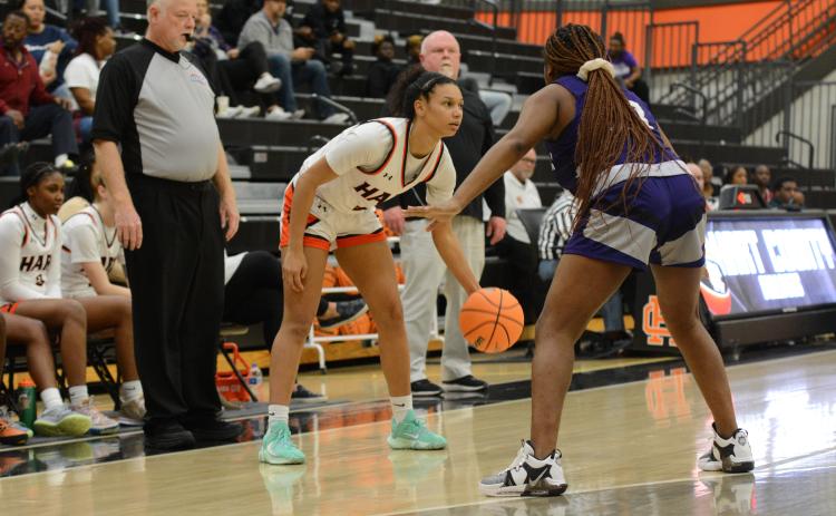 Junior guard Alexis Walker looks to pass the ball to an open teammate in the Lady Dogs first region win over the Monroe Area Lady Purple Hurricanes, 69-38 on Tuesday, Jan. 10.