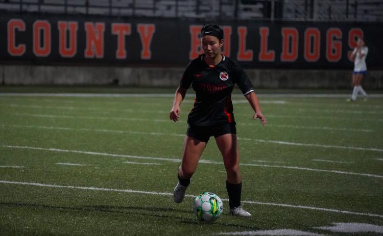 Senior forward Honor Chiang dribbles down the field as she scored two goals to pick up the Lady Dogs 4-2 win over Banks in the home opener to pick up the first win of the year. Photo taken by Lexie Wheless.