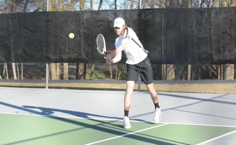 Pictured is Daniel Leard returning a serve in his 6-4, 6-3 win.