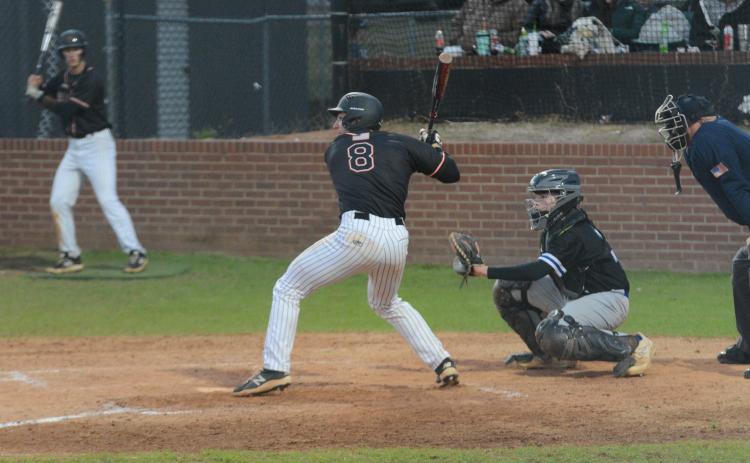 Pictured is senior catcher Riley Posey as he picked up an RBI single in the sixth inning to propel the Dogs to a 10-5 win over Oconee County on Tuesday.