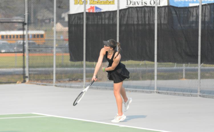 Ryleigh Jordan returns a serve as she wins her line versus Monroe Area on Tuesday, 6-4 and 6-1.