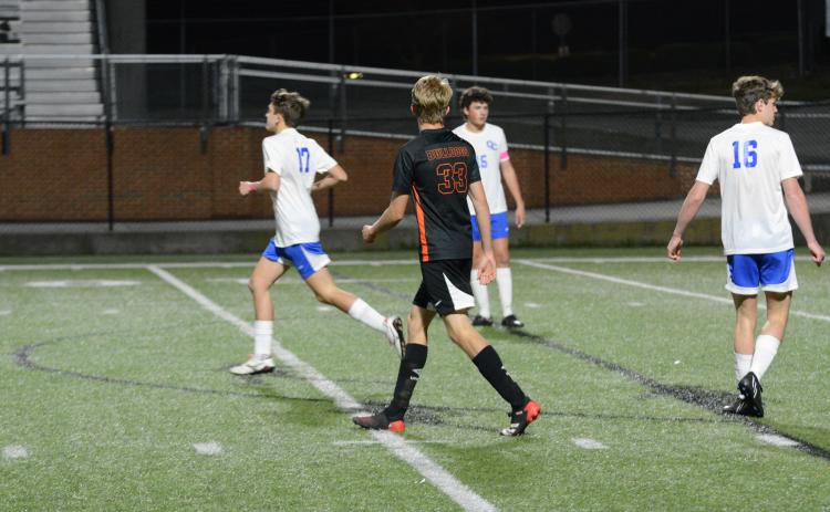 Freshman forward William Bell (33) puts multiple shots on goal in the 7-1 home loss to Oconee County to begin region play.