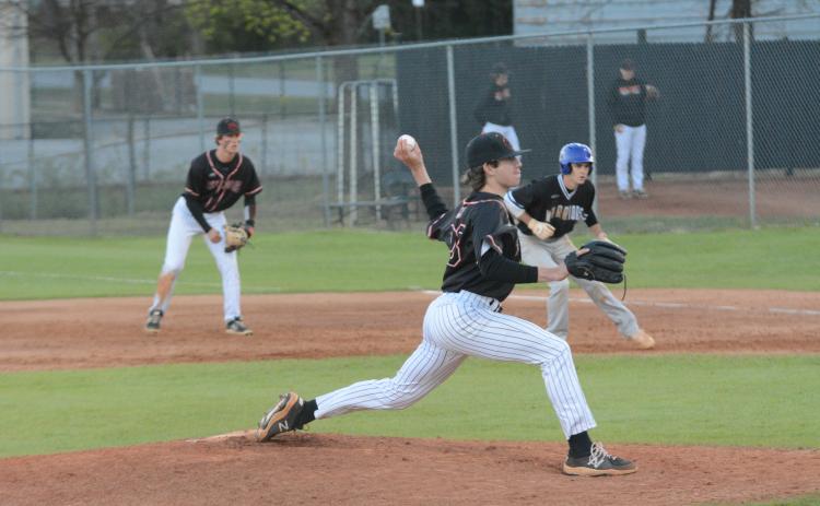 Junior starting pitcher Will Pittman delivers a pitch as the Dogs fall to Oconee in the double header on March 16.