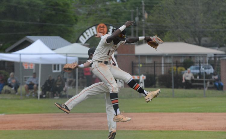 Seniors Paul Davis (1) and Jordan Leach celebrating after the game one 11-2 win over Stephens County on April 13.