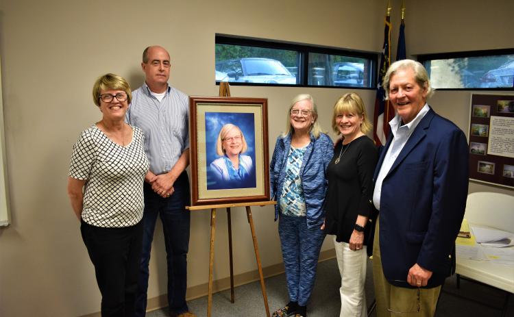 L-R: Glada Horvat, Richard Sanders, Emily Gunnells, Gail Gunnells and Walter Gordon stand alongside the newly unveiled portrait of Emily Gunnells, which will hang in a place of prominence in the Hart County Adult Learning Center. 