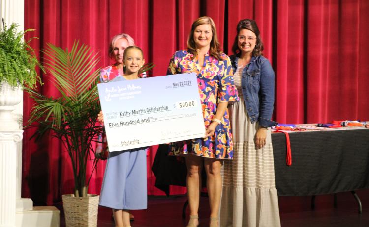 Andie Jane Holmes (front) was recognized at the North Hart Elementary award’s ceremony for raising funds for the annual Kathy Ford Martin Memorial Scholarship. 