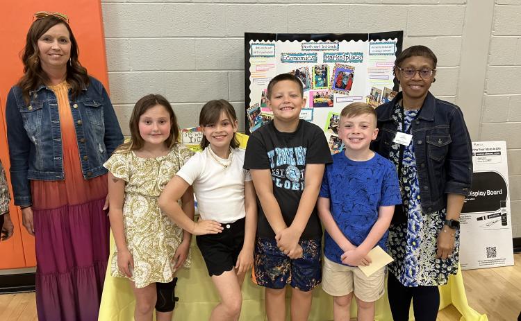 Third graders at North Hart Elementary showcased their economic marketplace at this year’s STEAM Showcase. Pictured are (L-R) Jamie Roberts, Lailan Carter, London Reagin, Brayden Shankle, Harrison Carter and Debbie Hughes. 