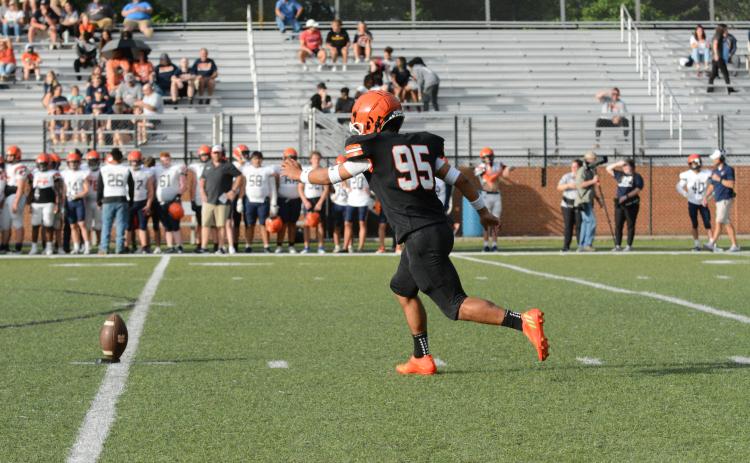 Rising senior kicker Axsel Fajardo gets ready to boot the ball away to kickoff the 2023 spring game versus Habersham Central on Friday, May 19.