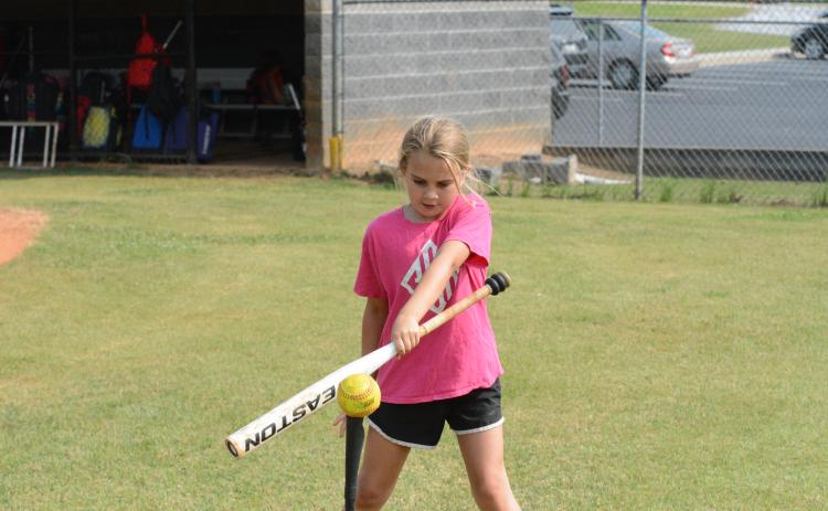 Chaylei Carter works on her swing during the 2023 HCHS softball camp on June 5-6.