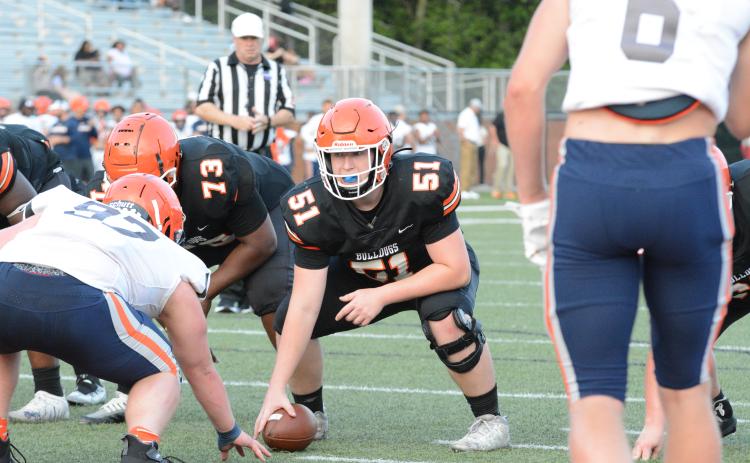 Rising junior offensive lineman Adam Broom (51) gets ready to snap the football during the 2023 spring game versus Habersham Central on Friday, May 19 from Herndon Stadium. 