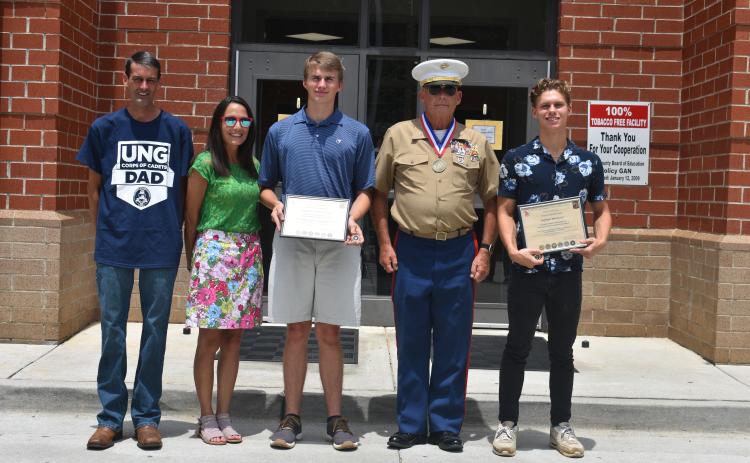 The Georgia Military Veterans Hall of Fame recently presented certificates to two Hart County High School graduates. Pictured from left are Keith McLane, Jamie McLane, Kaden Johnson-McLane, Chief Warrant Officer 4 Ray Fairman (retired) and Andrew Brezeale.