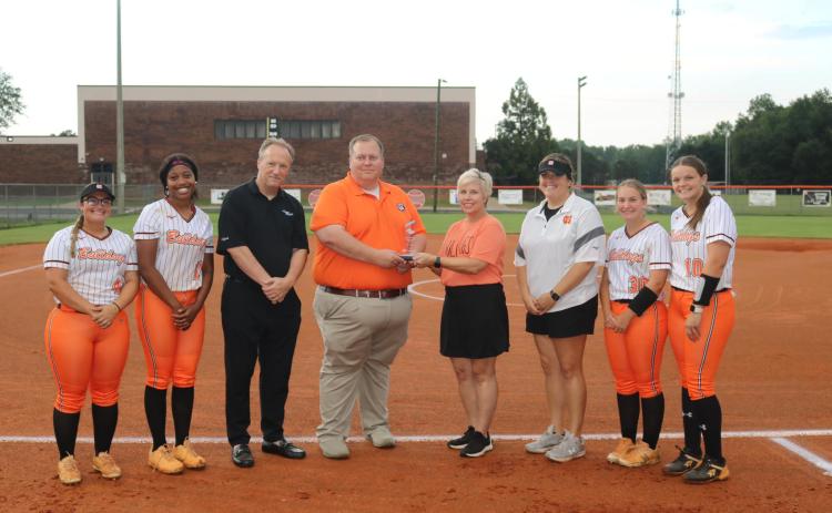 The GHSA Spirit Sportsmanship Award was presented before the Aug. 24 Lady Bulldogs softball game against Washington Wilkes. From left is Alexis Davis, Jazz Shealer, Georgia Public Broadcasting’s Jon Nelson, Hart County High School principal Kevin Gaines, Hart EMC’s Angie Brown, Lady Dogs head coach Katie Jo Gentry, Allie O’Bannon, and Gracie Cook.