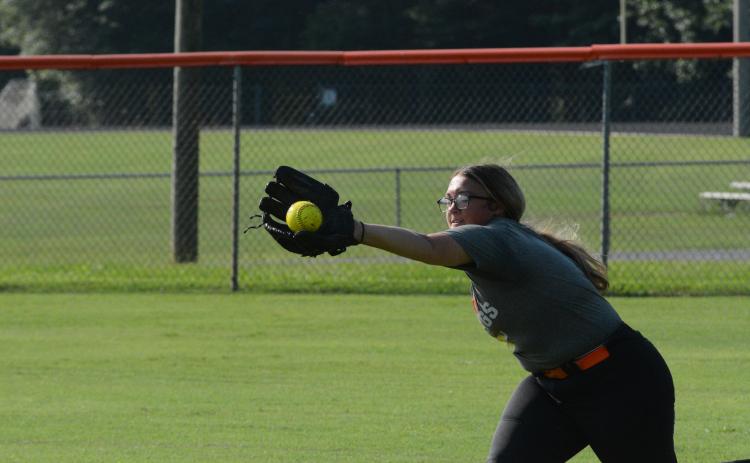 Senior outfielder Alexis Davis dives for the catch during a summer practice as they prepare for their season opener on the road versus Jackson County on August 8.