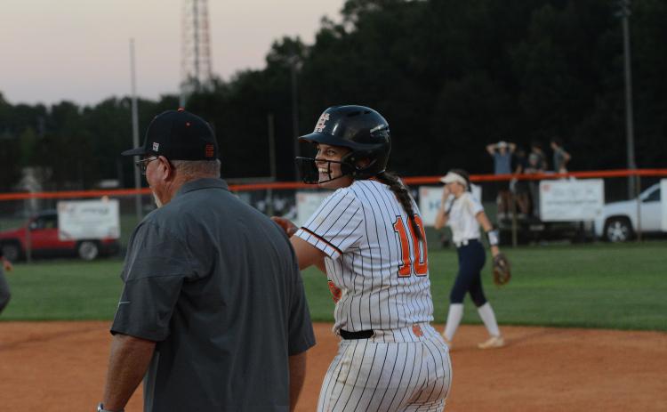 Senior infielder Gracie Cook smiles after driving home an insurance run in the sixth inning to take down the Lady Blue Devils, and avenge thier 12-3 road loss to Elbert County from the week prior, 6-3 Aug. 17.