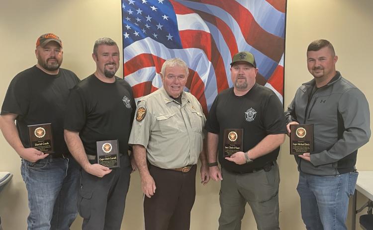 From left to right: Former sheriff’s deputy David Cook, Captain Chris Carroll, Sheriff Mike Cleveland,  Sergeant Chris O’Barr, and Captain Michael Davis.  