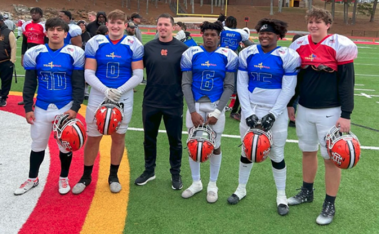 Pictured from left is kicker Axsel Fajardo, tight end Josh Donkersgoed, defensive backs coach Stephen Gomez, running back and saftey Jamir Rucker, defensive end Trez Fouch, and offensive lineman Owen Kesler after the All Athens Area FCA All-Star Game at Clark Central High School.