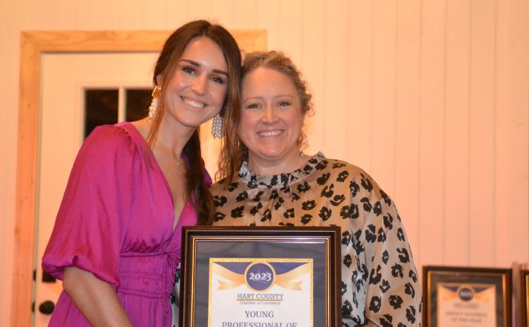 Hart County Chamber of Commerce Executive Director Lindsey Ingle presents owner Eliza Banks of Banks Hollow with the Young Professional of the Year award Jan. 27 during the chamber’s awards gala. 