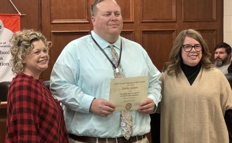 From left to right: Superintendent Jennifer Carter, HCHS Principal Kevin Gaines, and Board Chair Kim Pierce. Gaines was recognized for HCHS exceeding the state average in all five categories of the College and Career Readiness Performance Index (CCRPI).