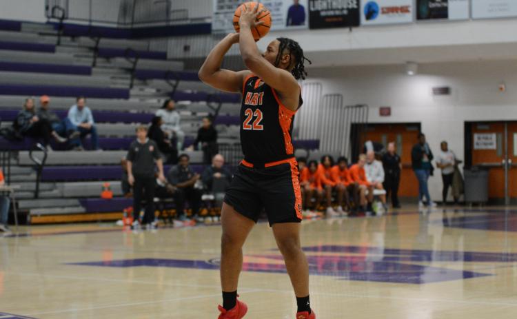 Senior forward Micah Reese at the free throw line in the 81-67 road loss to Jefferson High School on Dec. 19 of 2023 