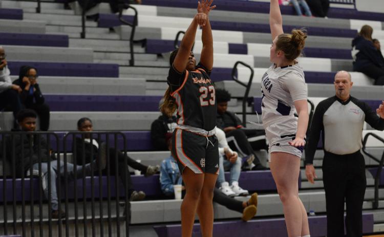 Junior guard TK Smith drills a three pointer over a Lady Hurricane, as she scored nine points, and led the team with seven rebounds and two assists in the 62-20 win over the Lady Hurricanes of Monroe Area on Jan. 10. 