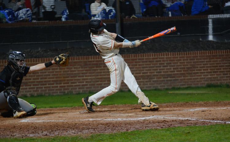 Freshman second baseman Crew Franklin collects a hit during the 7-5 win in game two of the double header against the Warriors of Oconee County on March 7.