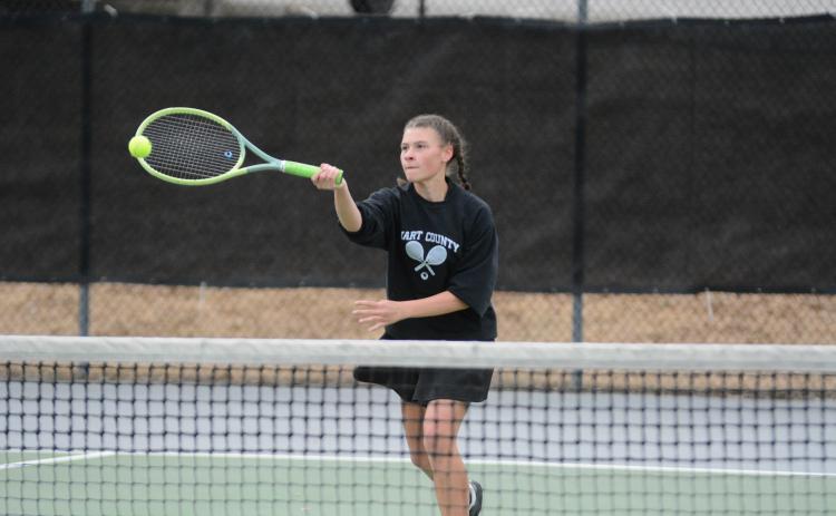 Pictured is Lyla Phillips as she returns a serve as she fell in the 10-point tiebreaker 10-8 against Monroe Area on Feb. 29.